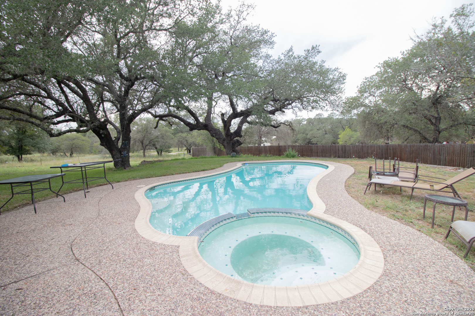 797 Killarney Road Floresville, TX 78114 - Photo 2 of 35 an outdoor view with swimming pool and outdoor seating