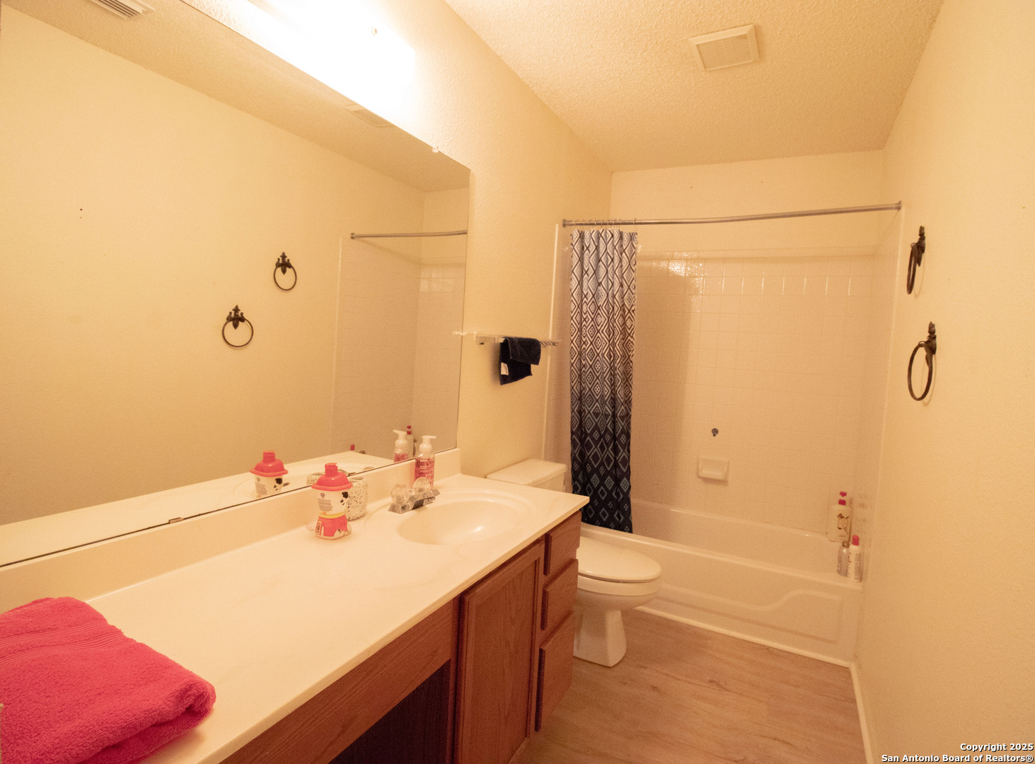 797 Killarney Road Floresville, TX 78114 - Photo 22 of 35 a bathroom with a sink a toilet and shower