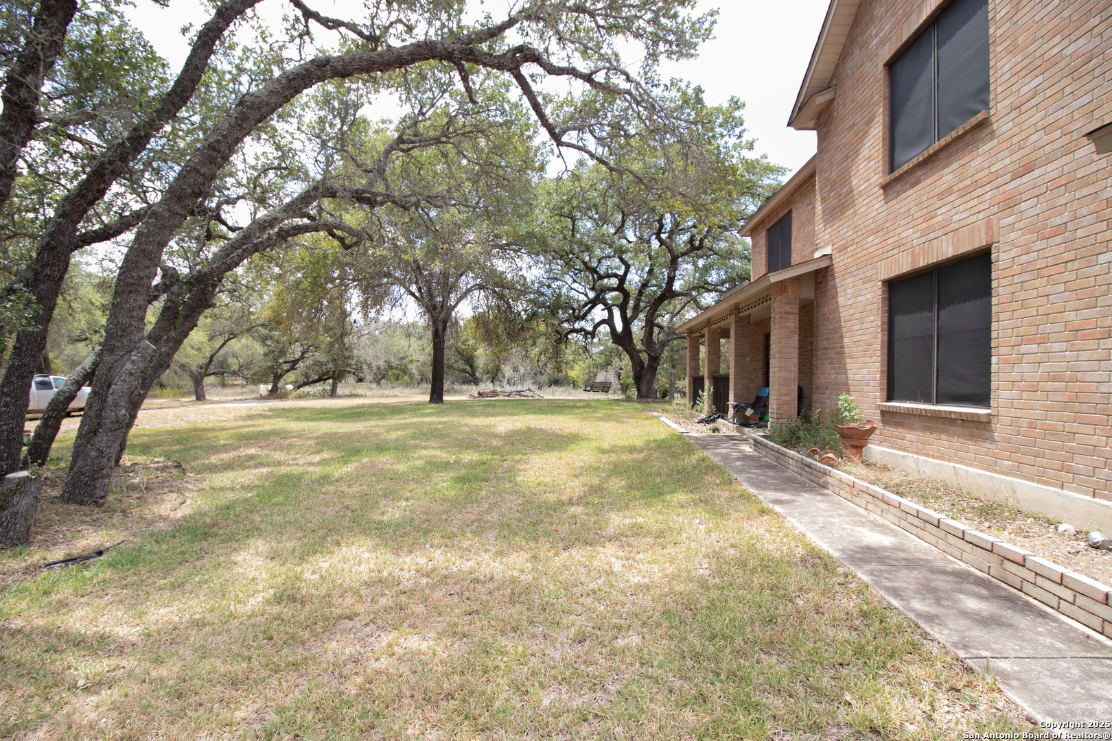 797 Killarney Road Floresville, TX 78114 - Photo 5 of 35 a view of yard with trees