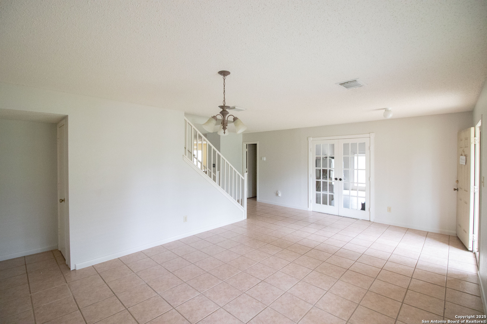 797 Killarney Road Floresville, TX 78114 - Photo 7 of 35 a view of a livingroom with a staircase