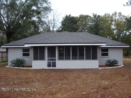 246 Alvis Road Jacksonville, FL 32220 - Photo 1 of 54 a front view of a house with a garden