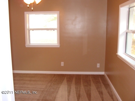 246 Alvis Road Jacksonville, FL 32220 - Photo 32 of 54 a view of an empty room with a window