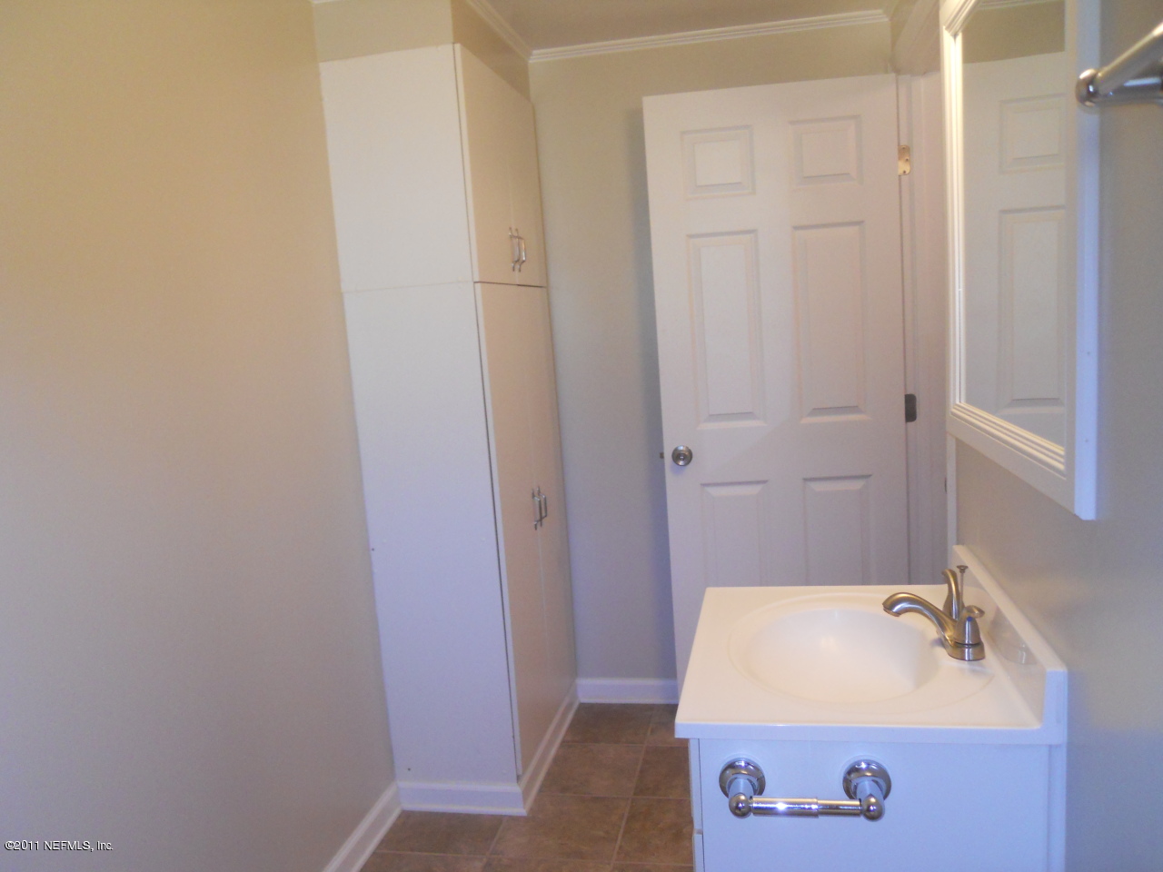 246 Alvis Road Jacksonville, FL 32220 - Photo 39 of 54 a bathroom with a sink and a mirror