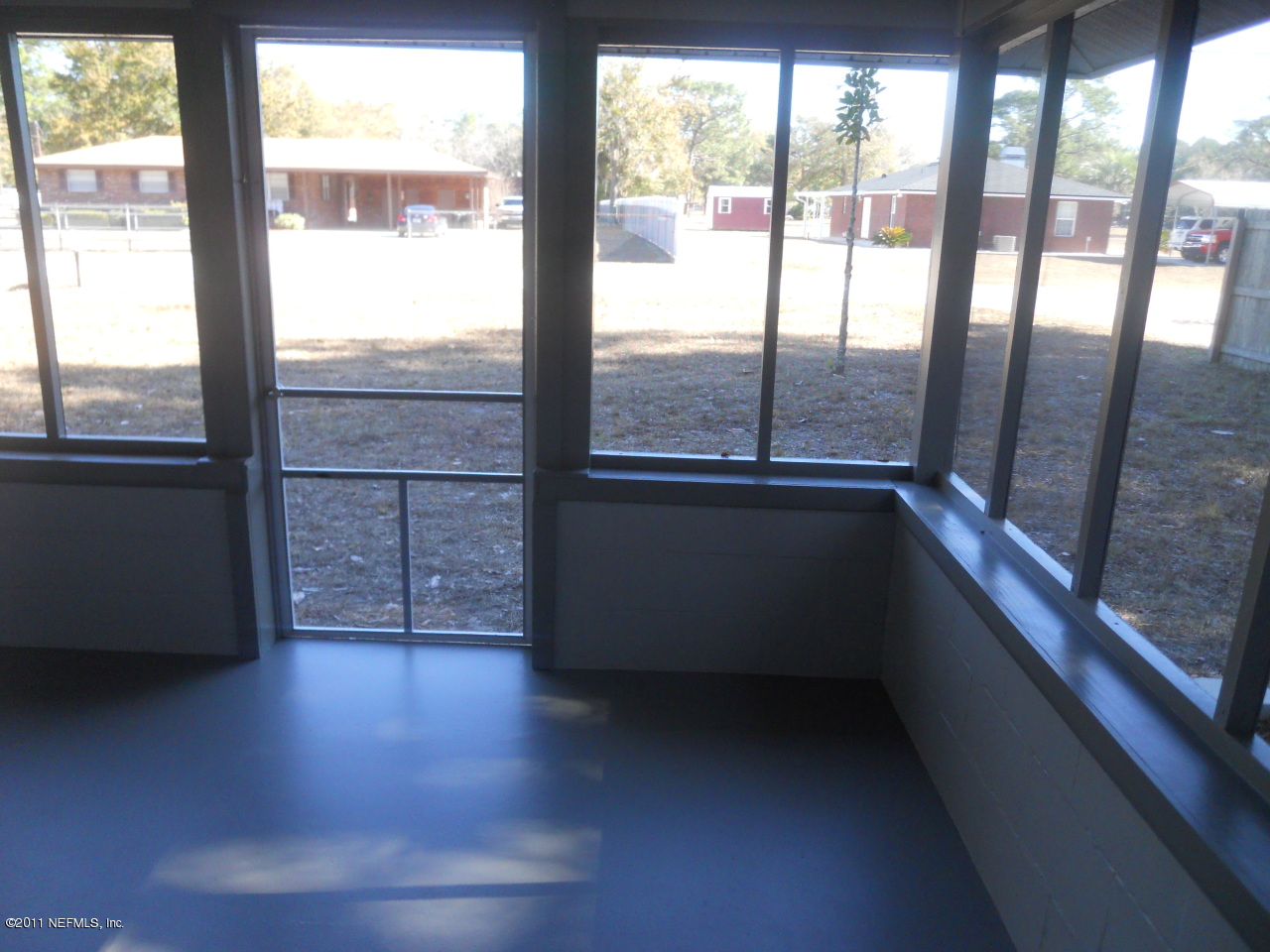 246 Alvis Road Jacksonville, FL 32220 - Photo 40 of 54 a view of an empty room and window