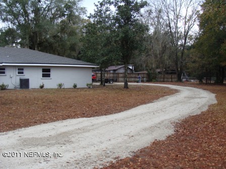 246 Alvis Road Jacksonville, FL 32220 - Photo 49 of 54 a house with trees in the background
