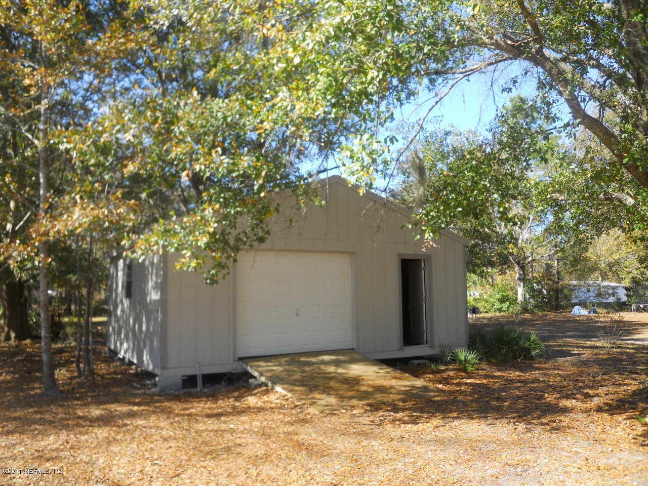246 Alvis Road Jacksonville, FL 32220 - Photo 50 of 54 a view of a house with a tree