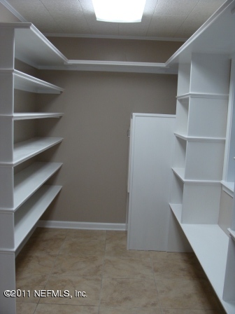 246 Alvis Road Jacksonville, FL 32220 - Photo 8 of 54 a view of an empty walk in closet
