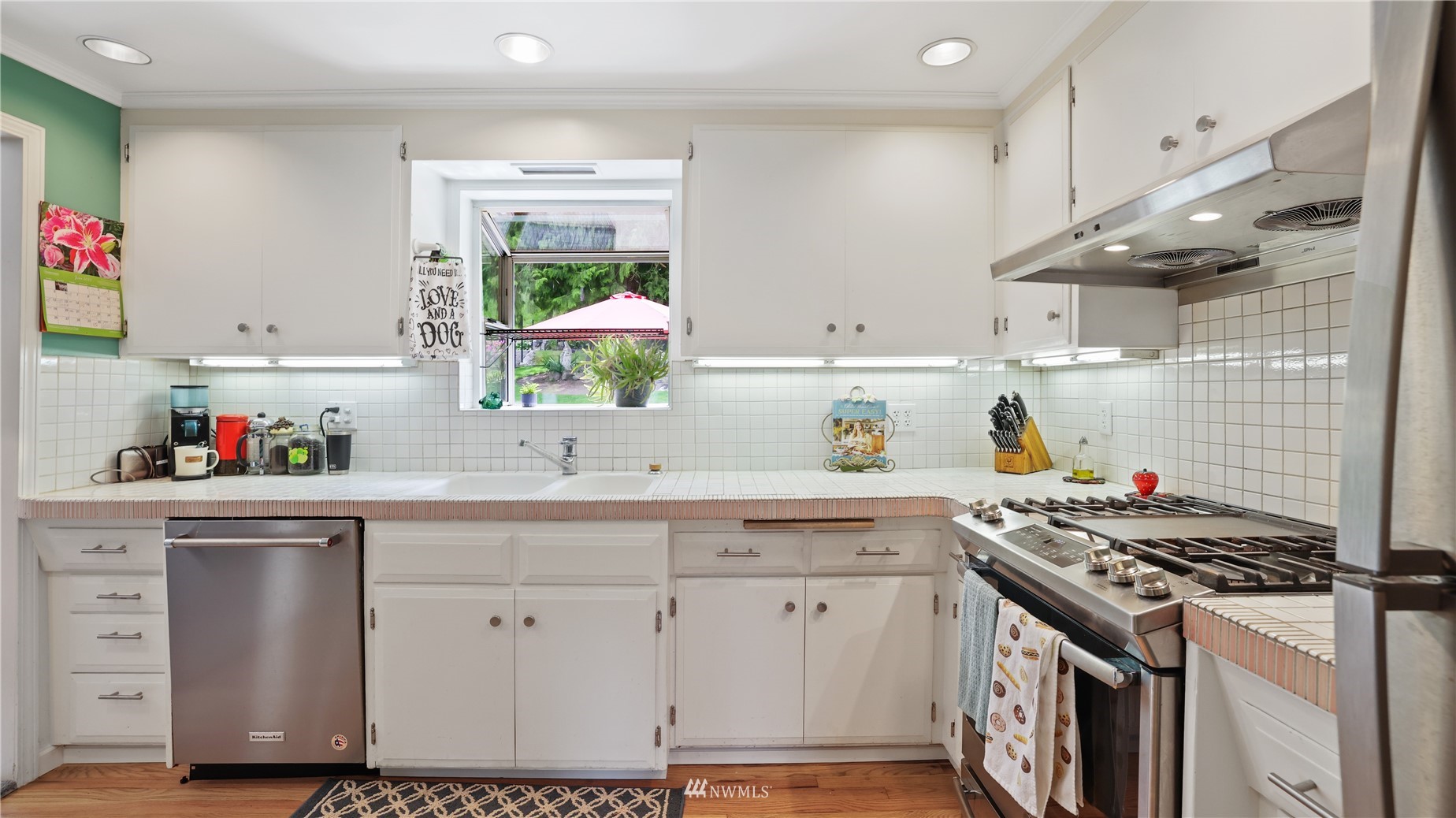 16819 Renton Issaquah Road Southeast Renton, WA 98059 - Photo 15 of 36 a kitchen with cabinets appliances and a window