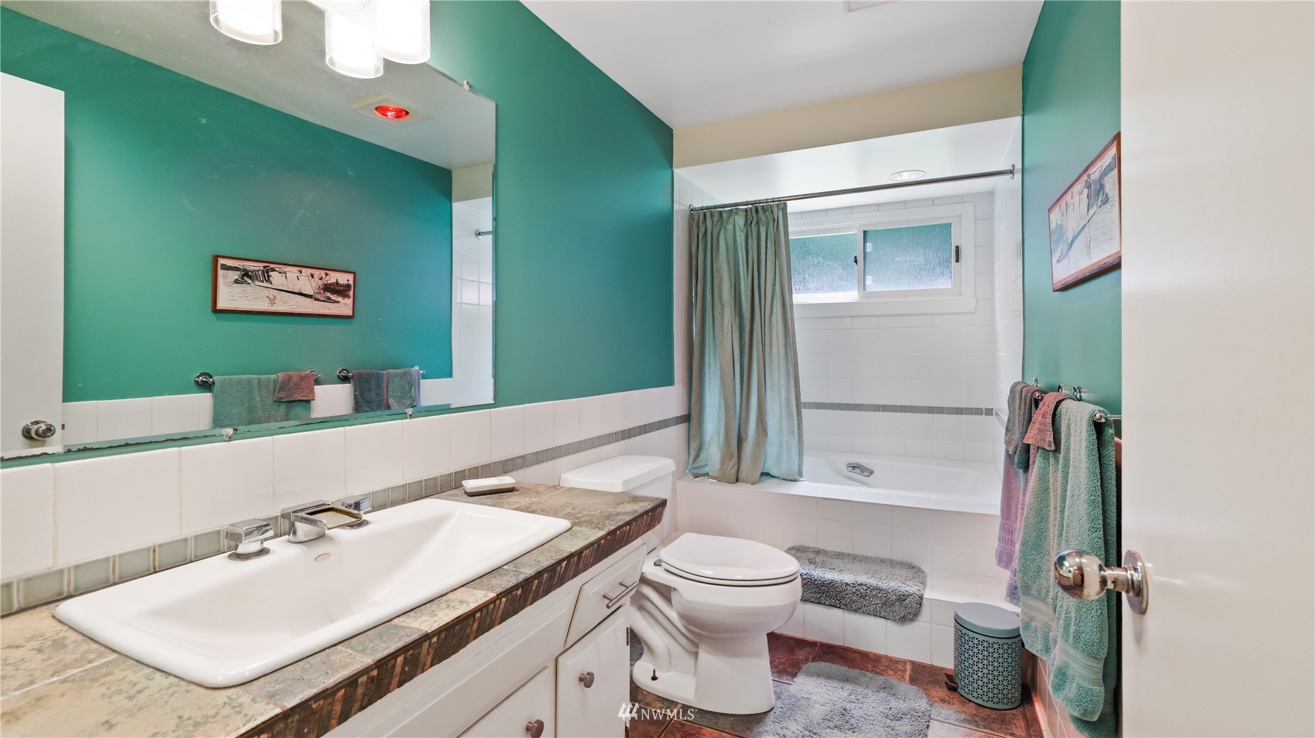 16819 Renton Issaquah Road Southeast Renton, WA 98059 - Photo 16 of 36 a bathroom with a sink mirror vanity and toilet