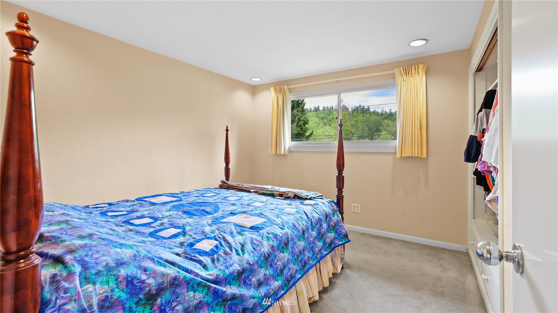 16819 Renton Issaquah Road Southeast Renton, WA 98059 - Photo 17 of 36 a bedroom with a bed and a window