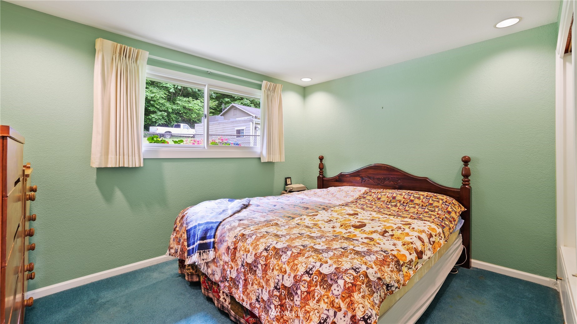 16819 Renton Issaquah Road Southeast Renton, WA 98059 - Photo 18 of 36 a bedroom with a bed and window