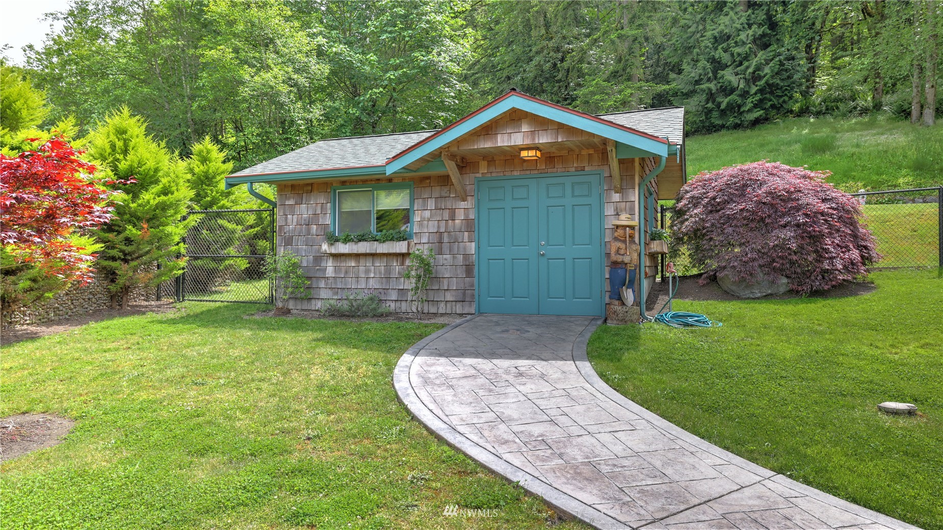 16819 Renton Issaquah Road Southeast Renton, WA 98059 - Photo 20 of 36 a front view of a house with a yard