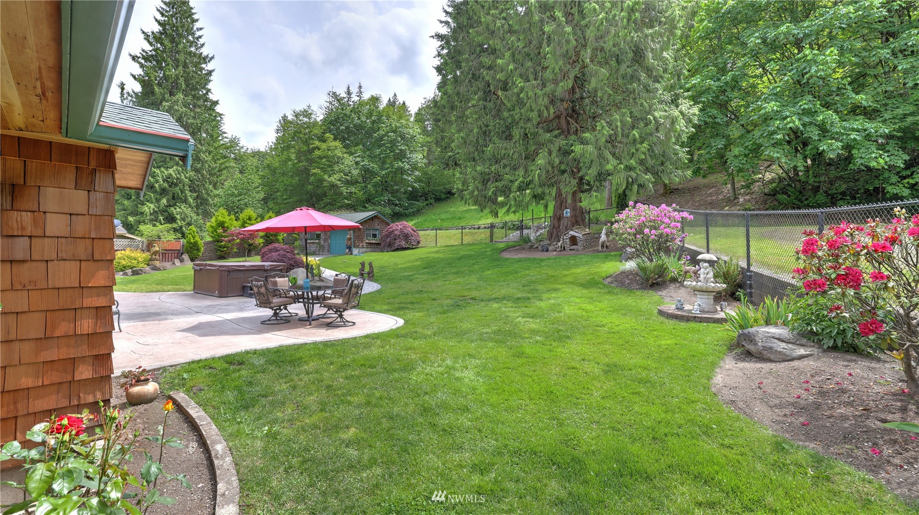 16819 Renton Issaquah Road Southeast Renton, WA 98059 - Photo 28 of 36 a view of a table and chairs under an umbrella