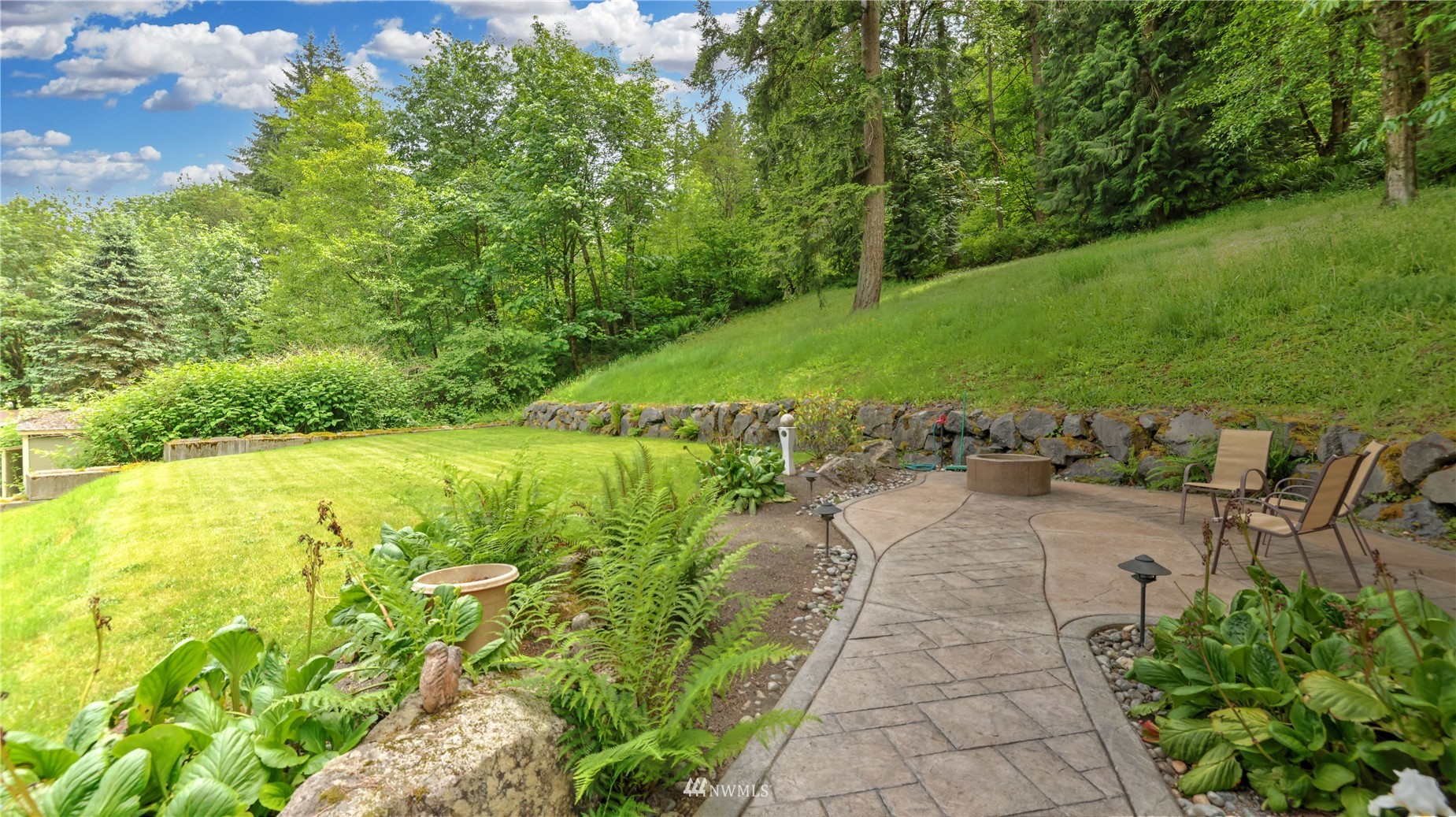 16819 Renton Issaquah Road Southeast Renton, WA 98059 - Photo 30 of 36 a view of a garden with lawn chairs