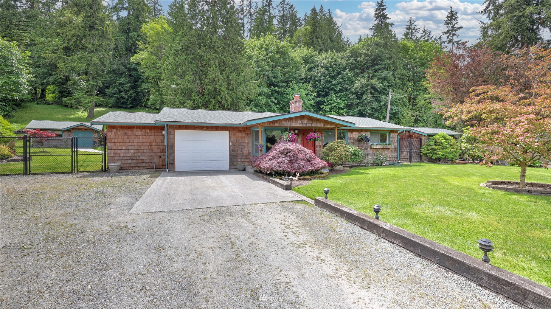 16819 Renton Issaquah Road Southeast Renton, WA 98059 - Photo 3 of 36 a front view of a house with garden