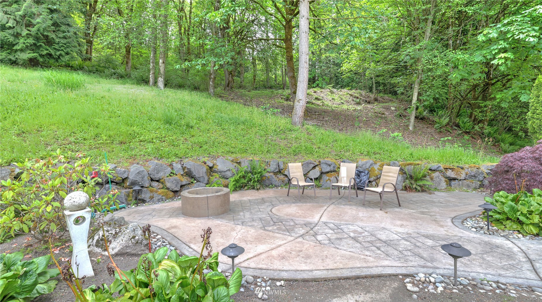 16819 Renton Issaquah Road Southeast Renton, WA 98059 - Photo 31 of 36 a view of a chair and table in the garden