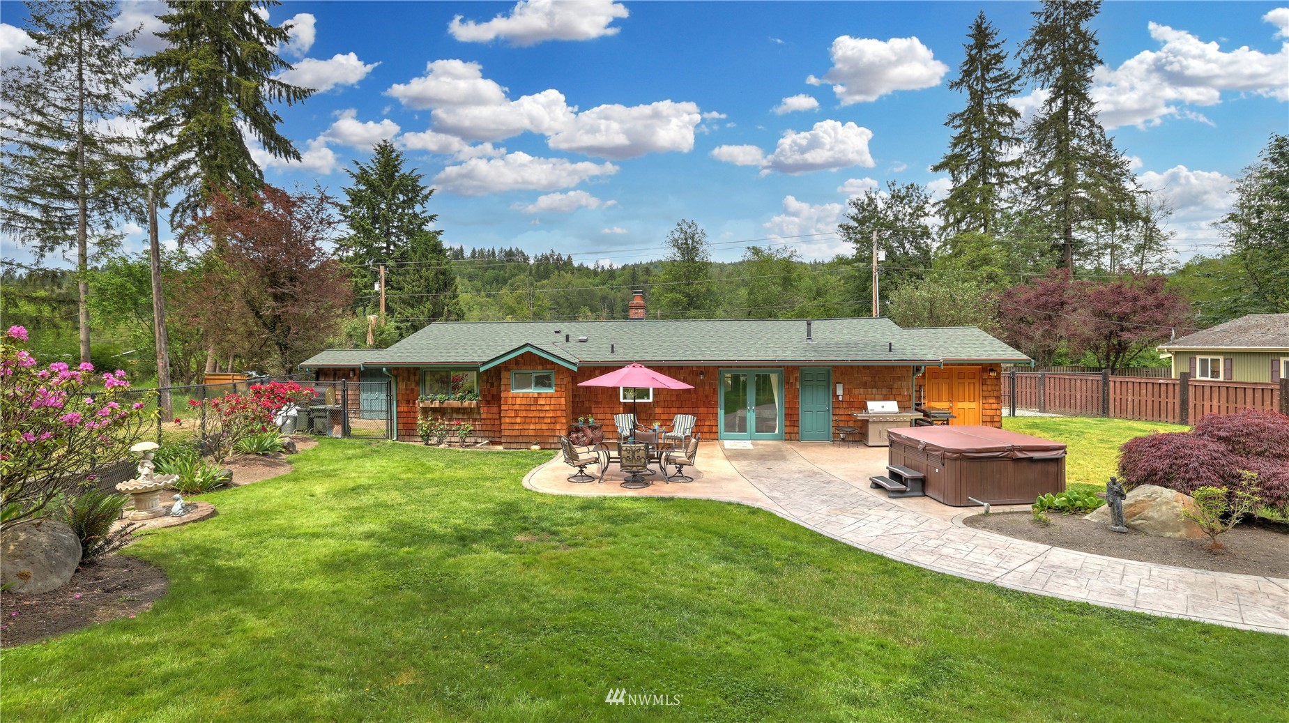 16819 Renton Issaquah Road Southeast Renton, WA 98059 - Photo 34 of 36 a front view of a house with garden