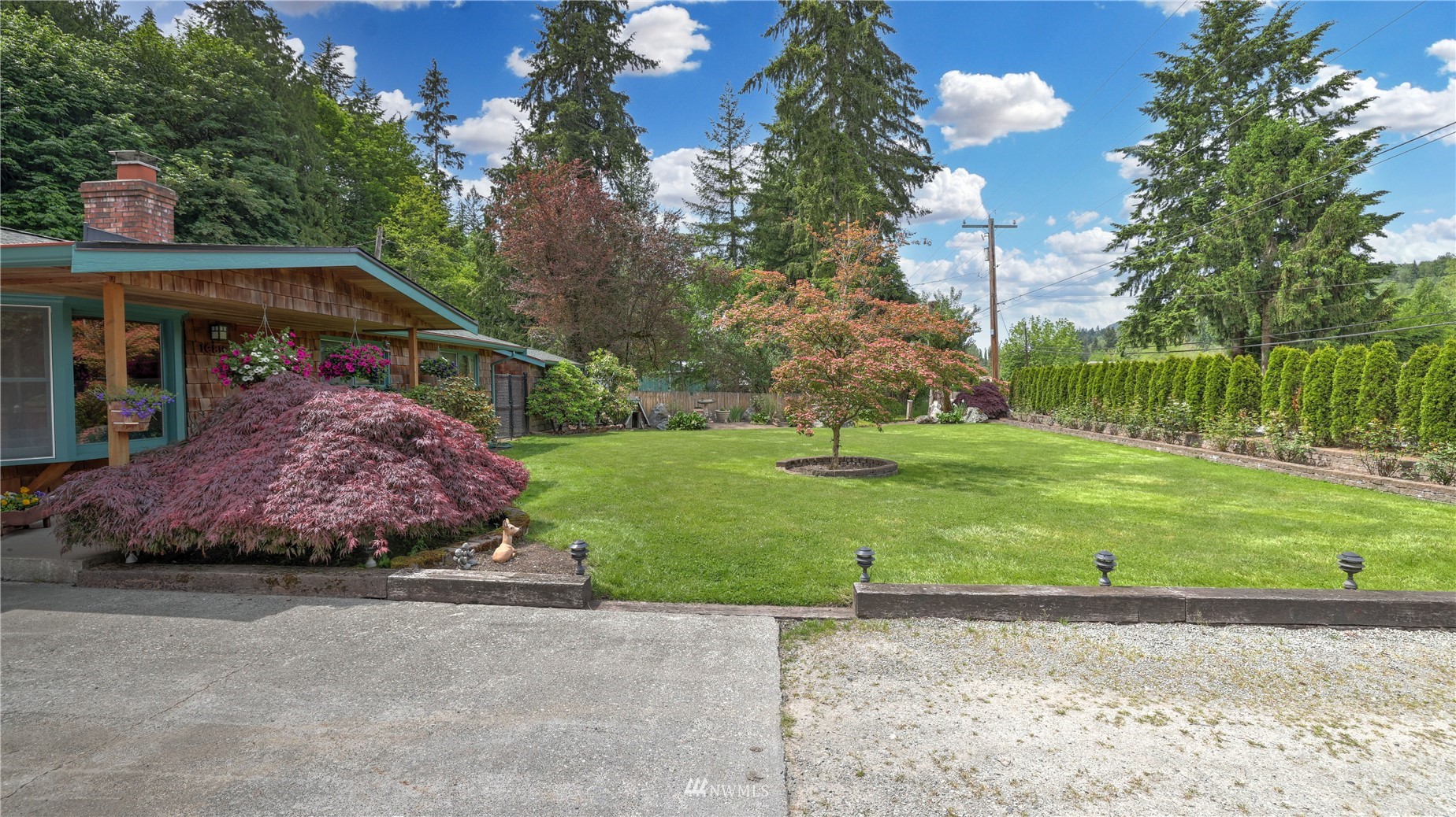 16819 Renton Issaquah Road Southeast Renton, WA 98059 - Photo 36 of 36 a front view of a house with garden