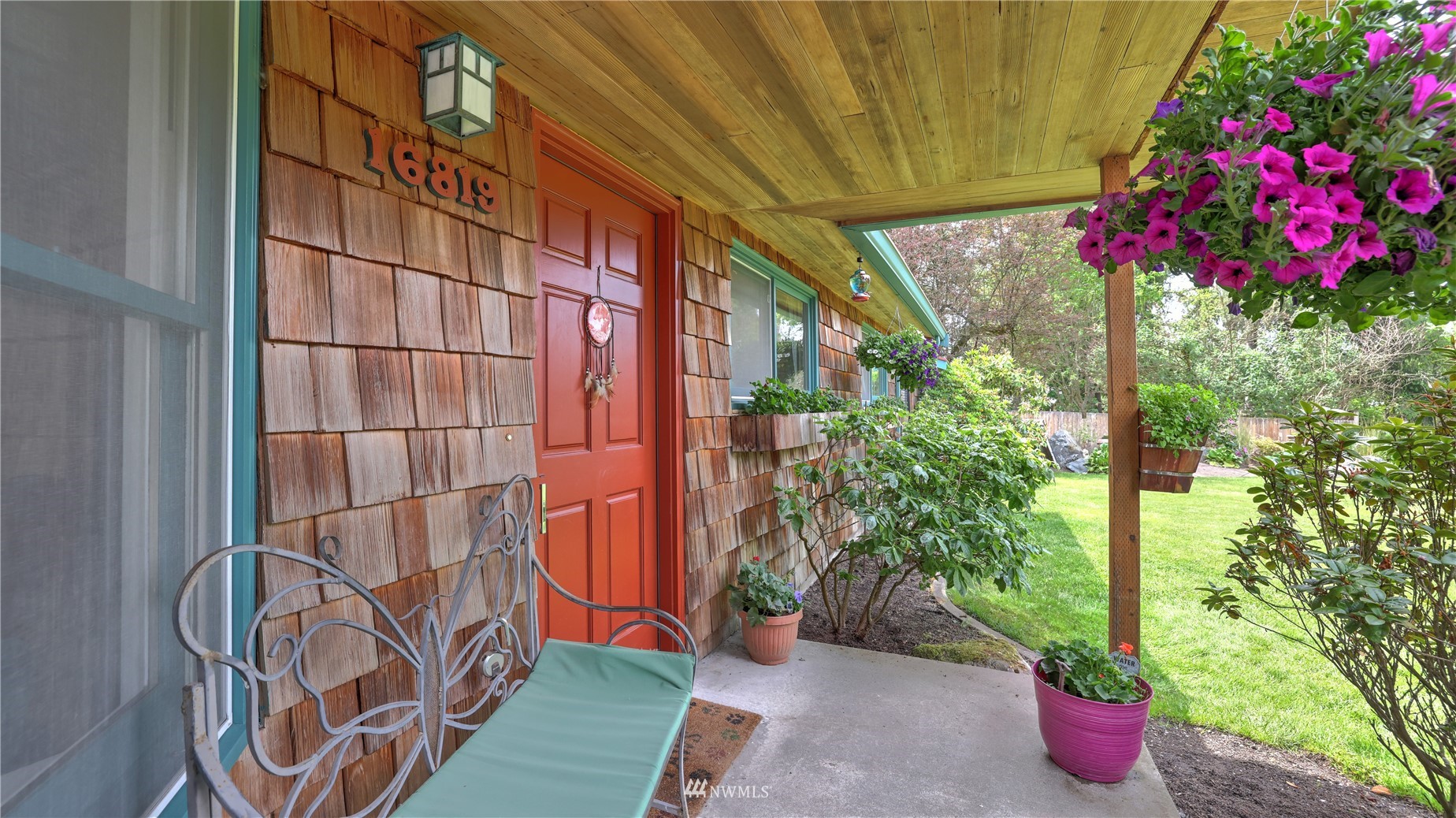 16819 Renton Issaquah Road Southeast Renton, WA 98059 - Photo 5 of 36 a backyard of a house with flower plants