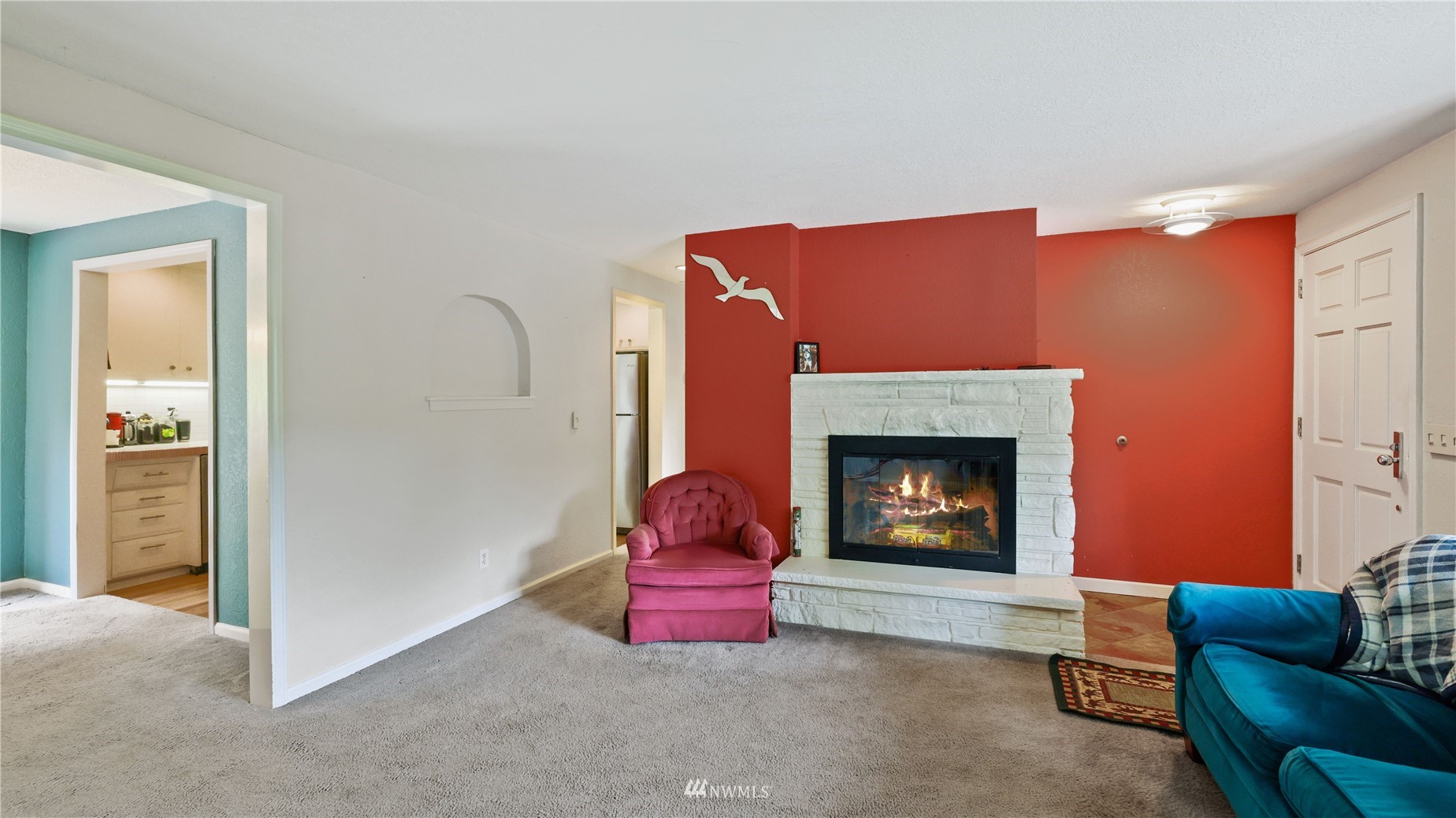 16819 Renton Issaquah Road Southeast Renton, WA 98059 - Photo 7 of 36 a living room with furniture and a fireplace