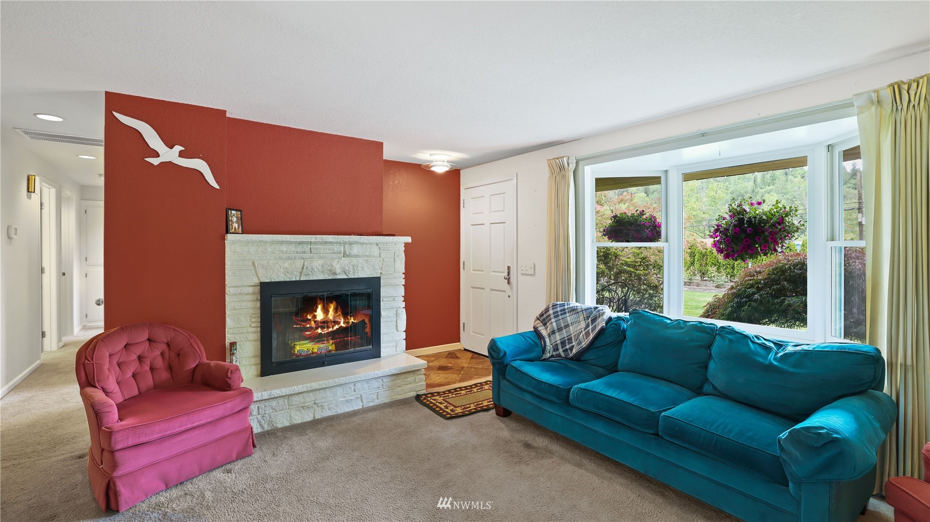 16819 Renton Issaquah Road Southeast Renton, WA 98059 - Photo 9 of 36 a living room with furniture and a fireplace