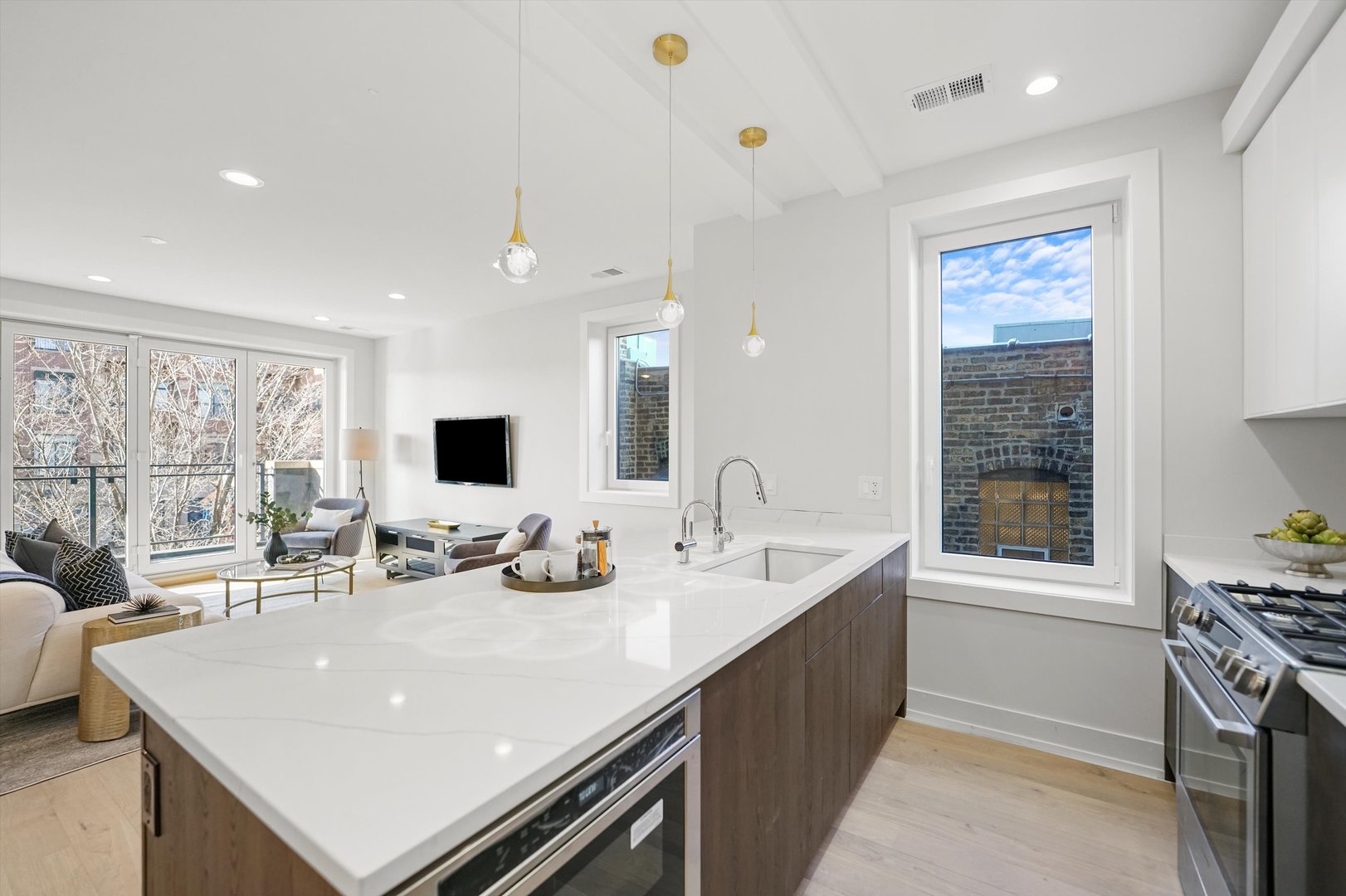 4647 North Clark Street, Unit 2 Chicago, IL 60640 - Photo 3 of 10 a large white kitchen with a large window