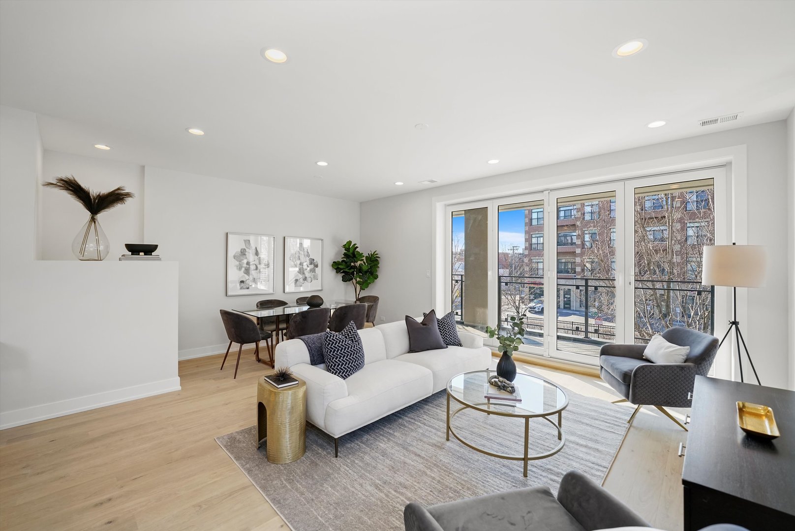4647 North Clark Street, Unit 2 Chicago, IL 60640 - Photo 4 of 10 a living room with furniture and a large window