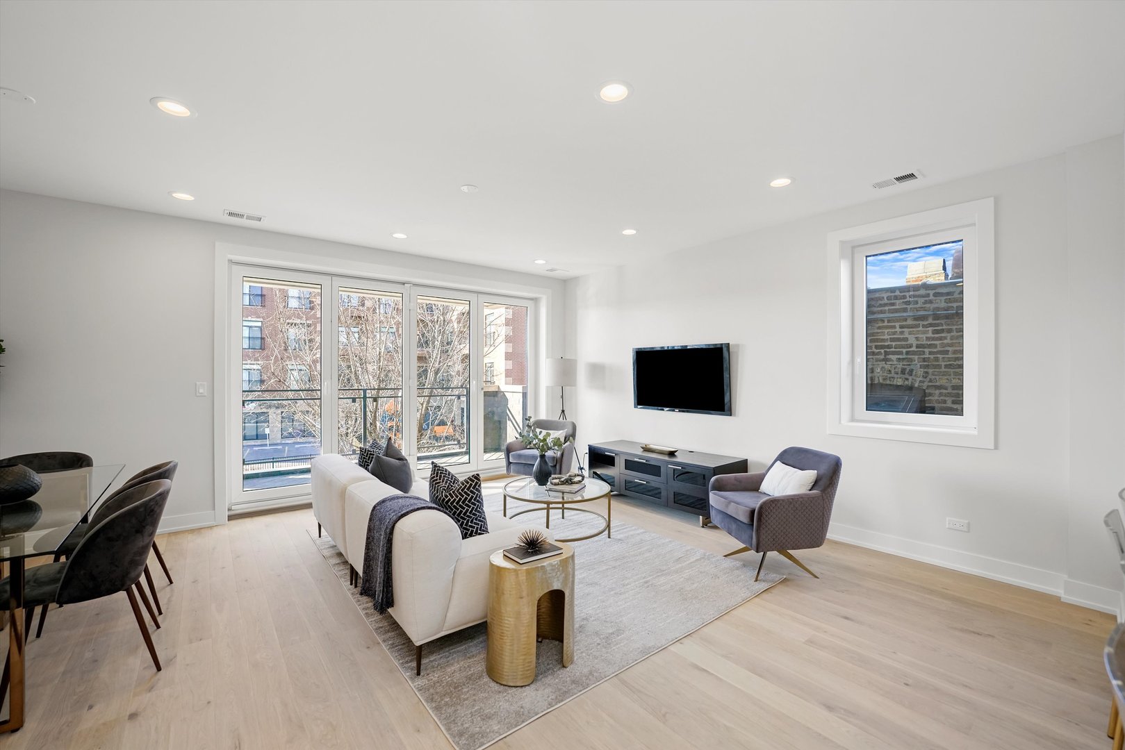 4647 North Clark Street, Unit 2 Chicago, IL 60640 - Photo 5 of 10 a living room with furniture and a flat screen tv