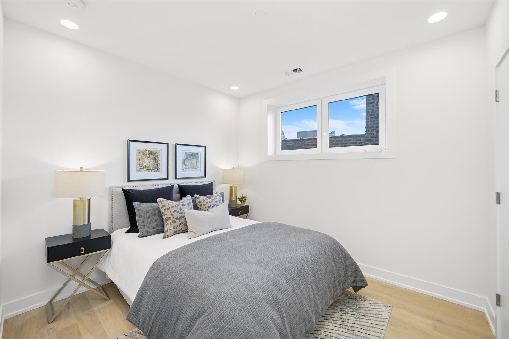 4647 North Clark Street, Unit 2 Chicago, IL 60640 - Photo 6 of 10 a bedroom with a bed and night stand