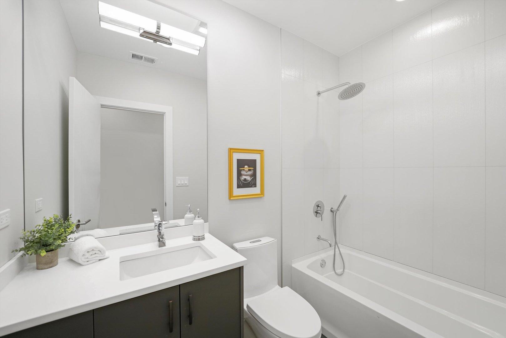 4647 North Clark Street, Unit 2 Chicago, IL 60640 - Photo 8 of 10 a bathroom with a sink toilet and shower