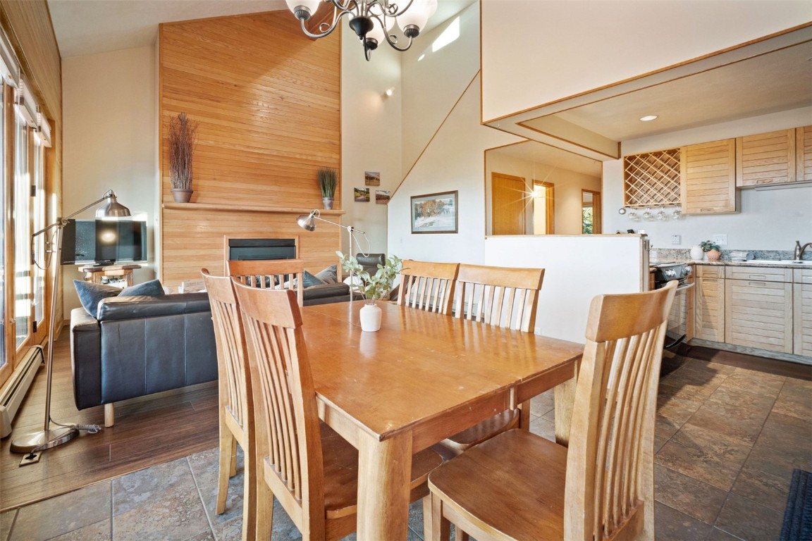 91400 Ryan Gulch Road, Unit 91425 Silverthorne, CO 80498 - Photo 12 of 42 a view of a dining room with furniture