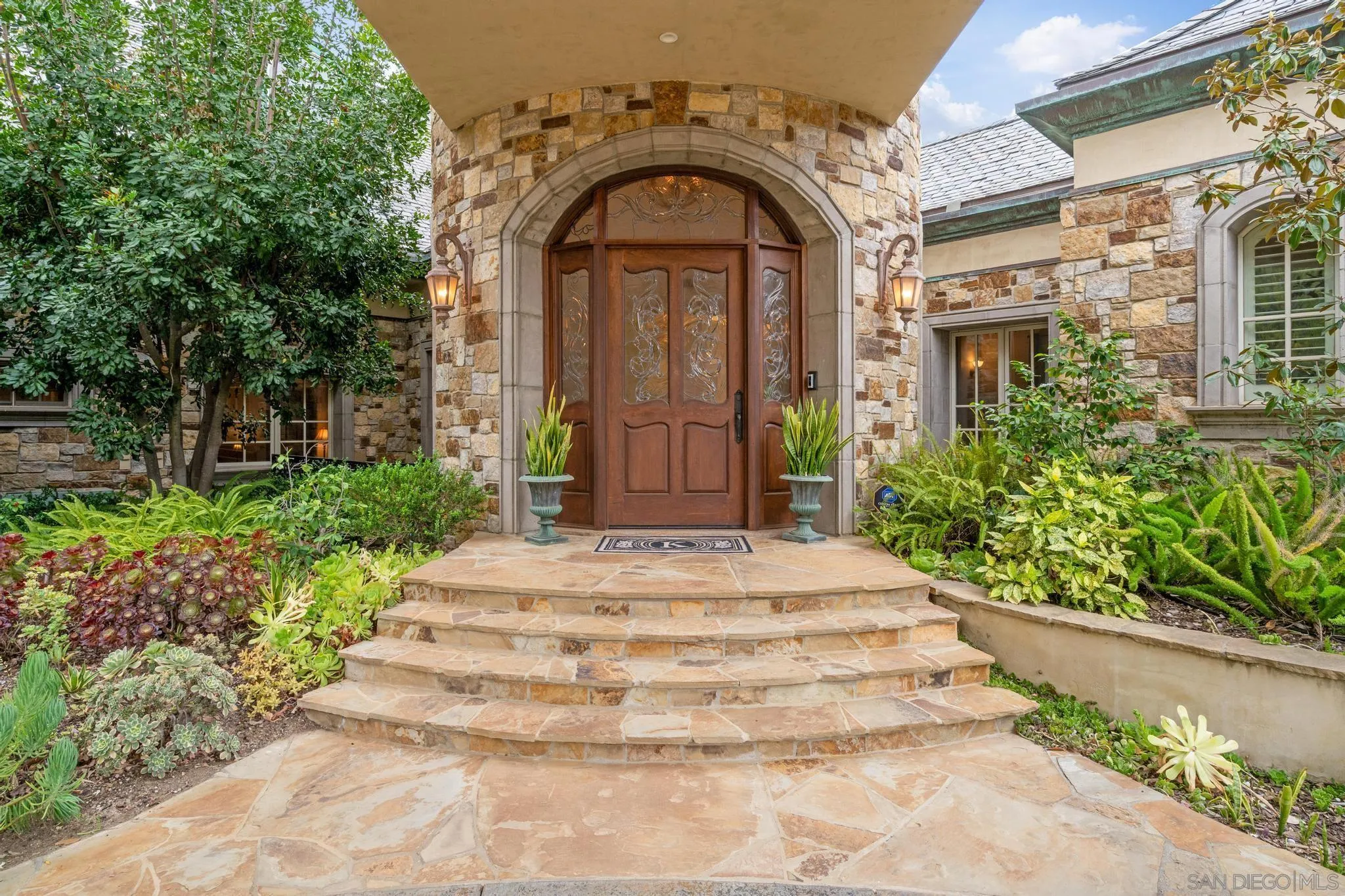14380 Ciera Court Poway, CA 92064 - Photo 4 of 51 a front view of a house with a garden