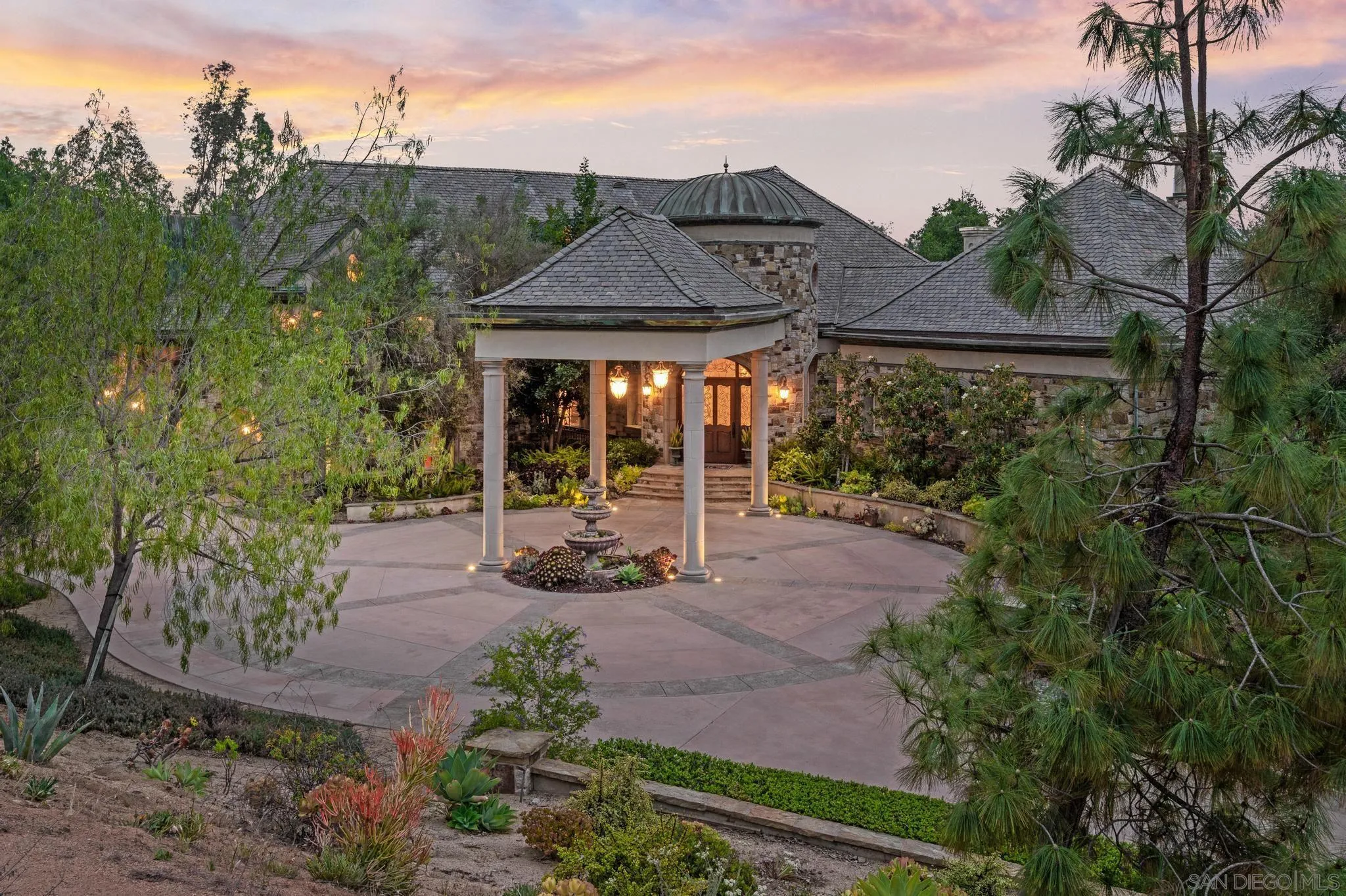 14380 Ciera Court Poway, CA 92064 - Photo 44 of 51 a view of a patio with table and chairs under an umbrella next to a yard