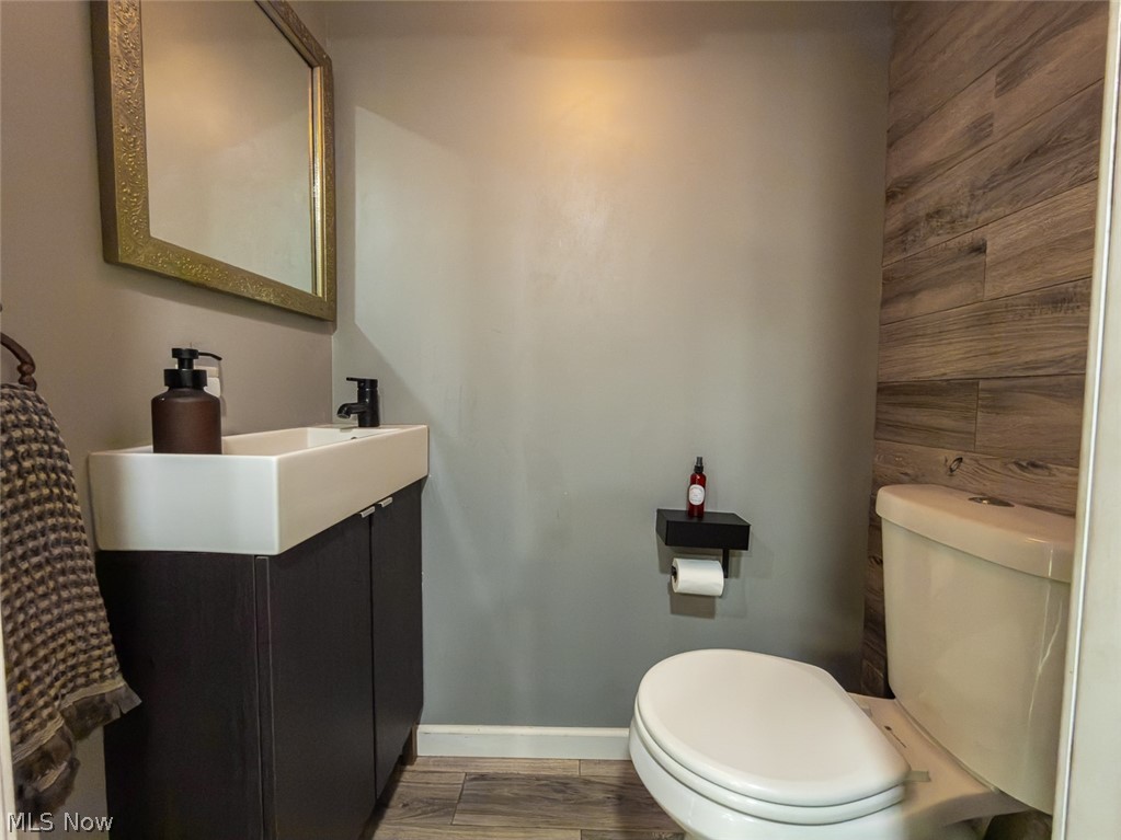 13429 West Calla Road Salem, OH 44460 - Photo 11 of 27 Powder room featuring a modern floating vanity with a rectangular basin, matte black faucet, and a framed mirror