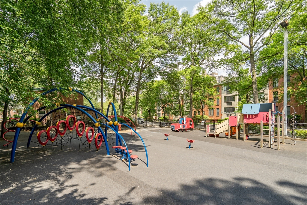 32 Juniper Street, Unit 91 Brookline, MA 02445 - Photo 18 of 21 an outdoor space with patio and white umbrellas