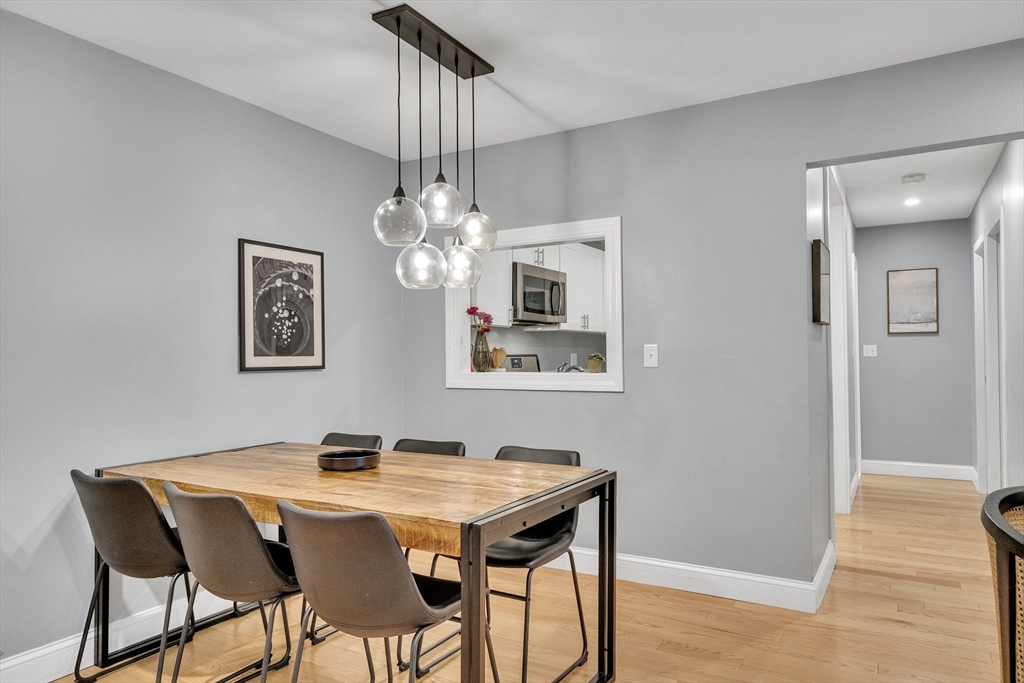 32 Juniper Street, Unit 91 Brookline, MA 02445 - Photo 3 of 21 a view of a dining room with furniture and wooden floor