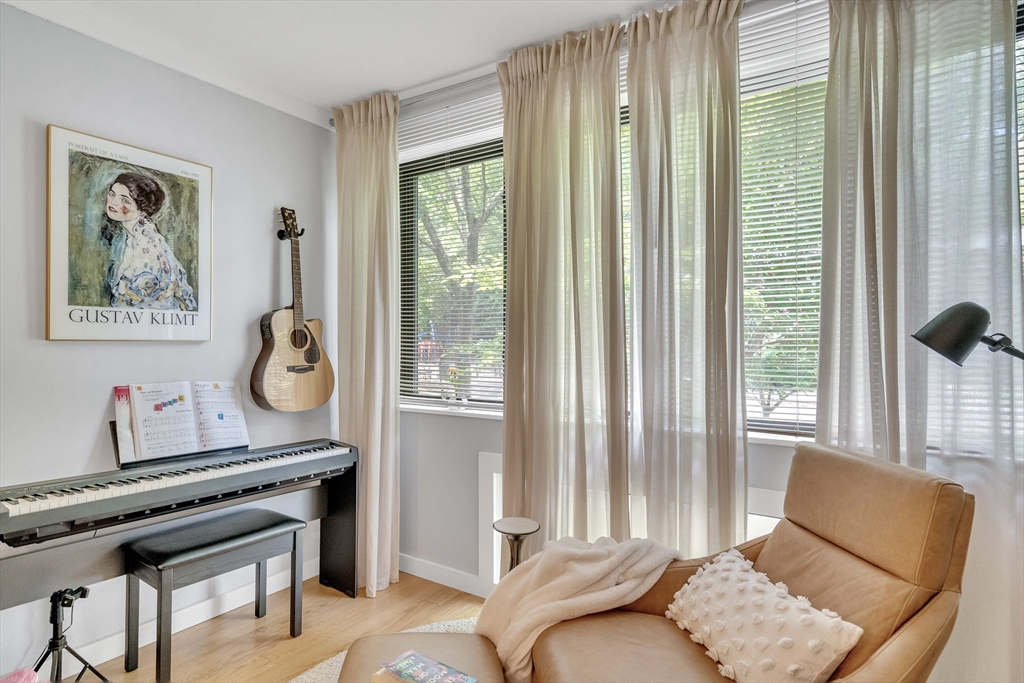 32 Juniper Street, Unit 91 Brookline, MA 02445 - Photo 7 of 21 a living room with furniture and a window