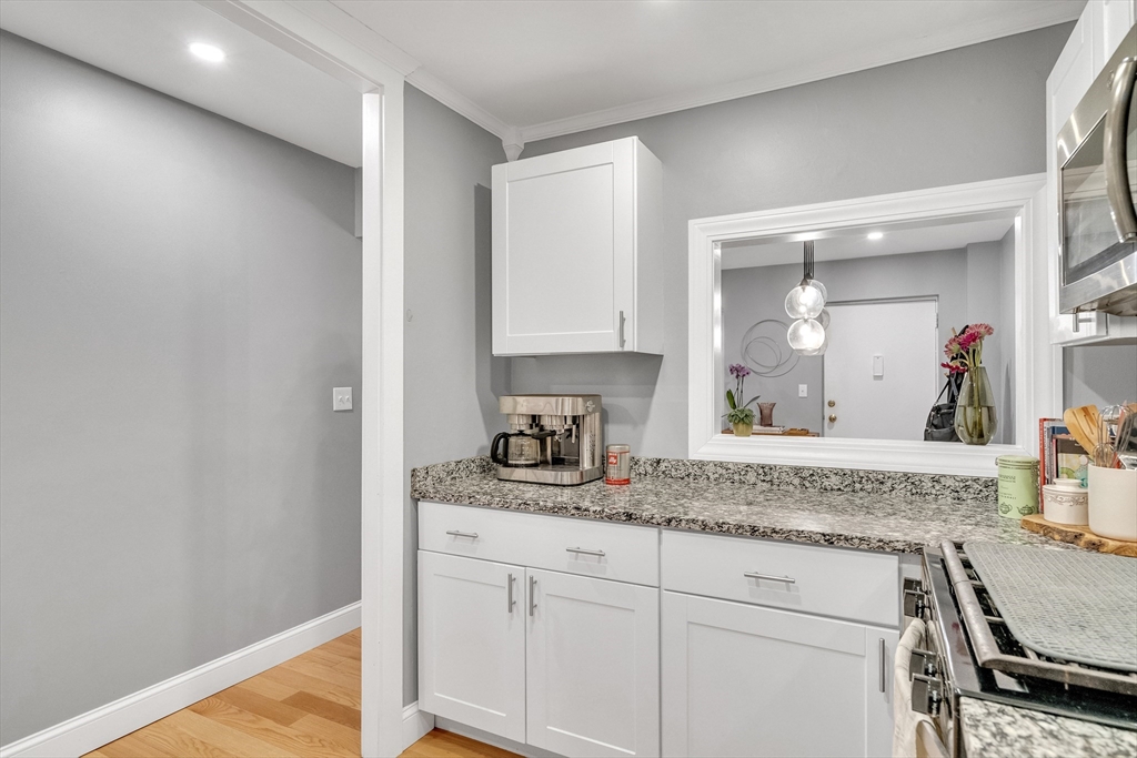 32 Juniper Street, Unit 91 Brookline, MA 02445 - Photo 9 of 21 a view of a kitchen cabinets and a counter top space