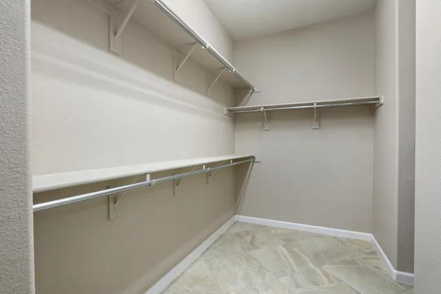 a view of a patio with table and chairs near a yard