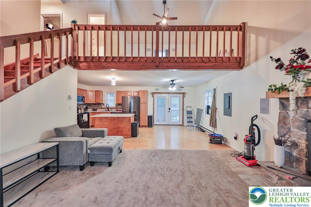 2114 Lakeview Road Bushkill, PA 18324 - Photo 81 of 83 An open floorplan connects the cozy living area with the kitchen and an upper loft.