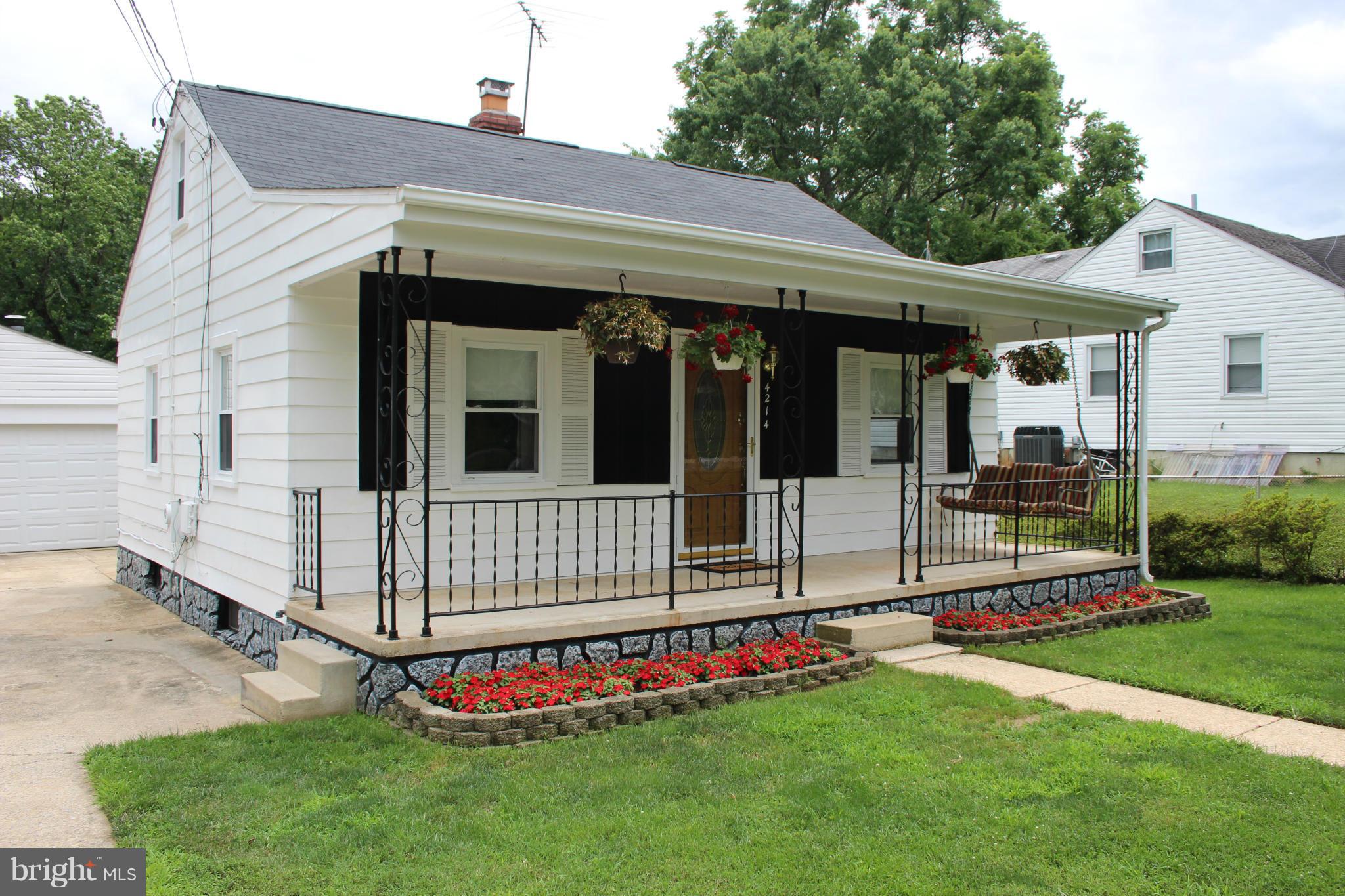 4214 Garrett Park Road Silver Spring, MD 20906 - Photo 2 of 22 a front view of a house with a yard