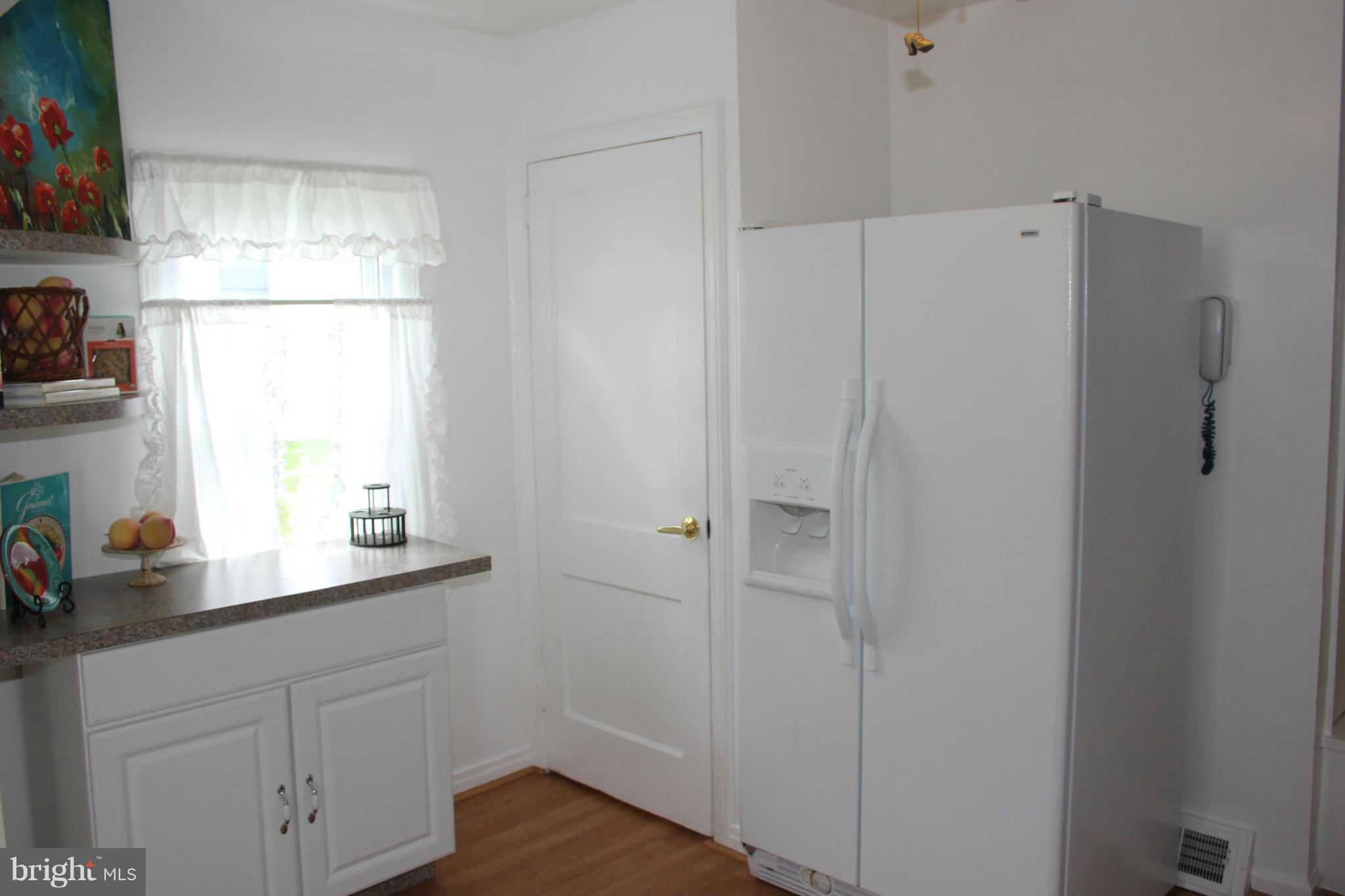 4214 Garrett Park Road Silver Spring, MD 20906 - Photo 12 of 22 a bathroom with a sink and a window