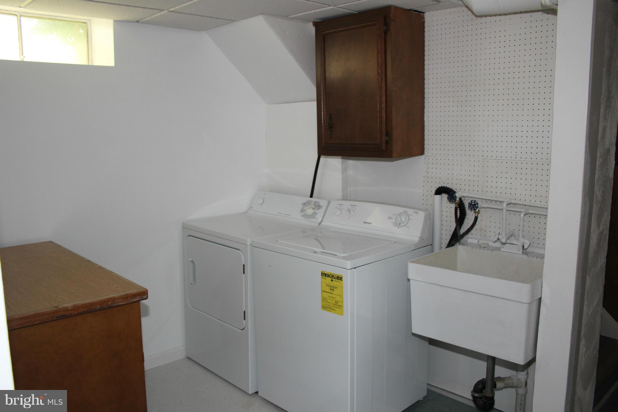 4214 Garrett Park Road Silver Spring, MD 20906 - Photo 19 of 22 a bathroom with a sink and a mirror