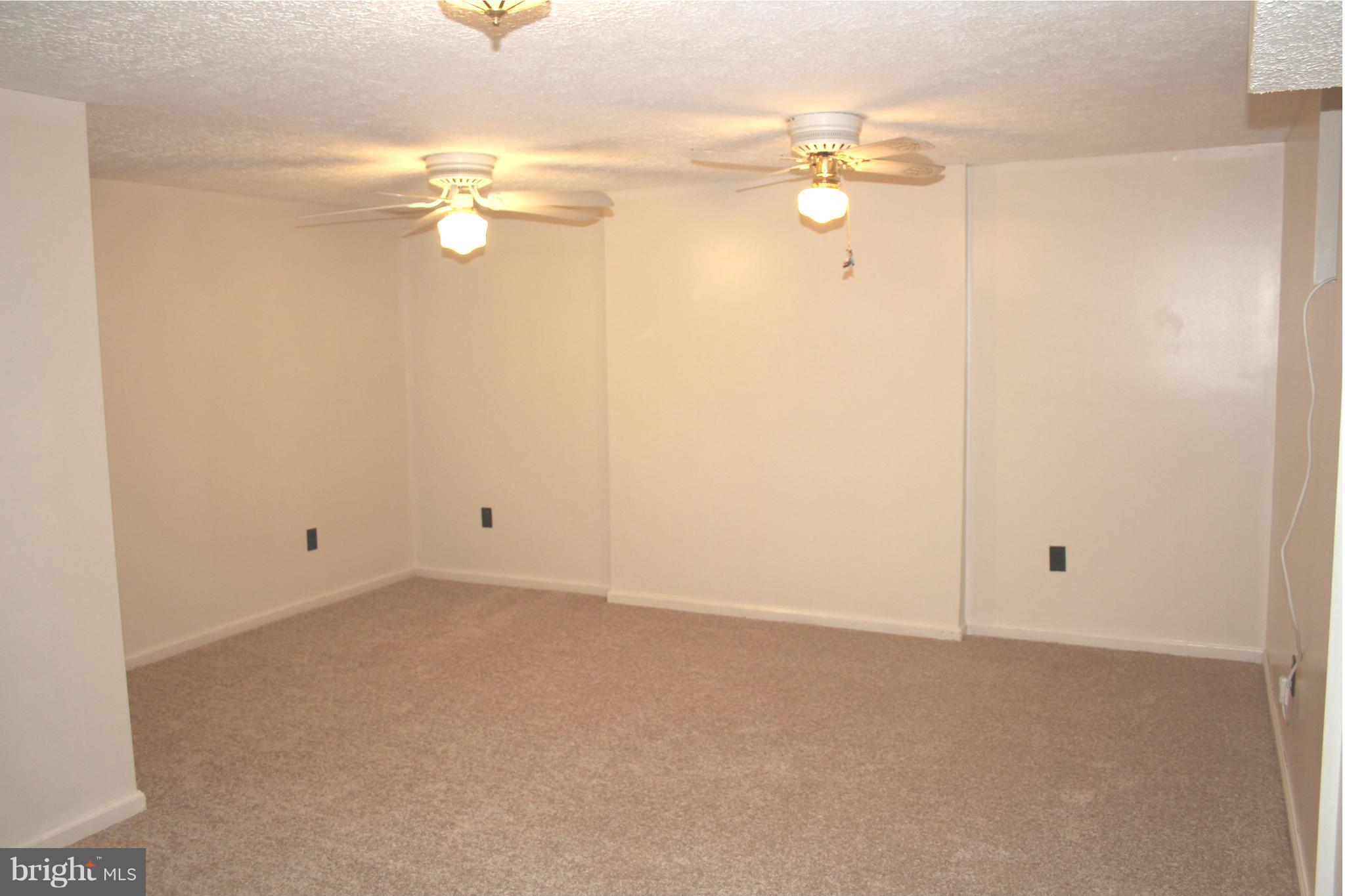 4214 Garrett Park Road Silver Spring, MD 20906 - Photo 20 of 22 a view of a room with wooden floor and window