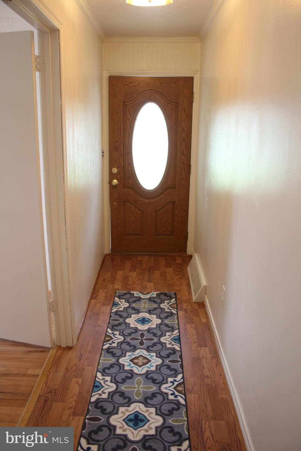 4214 Garrett Park Road Silver Spring, MD 20906 - Photo 5 of 22 a view of a hallway with wooden floor