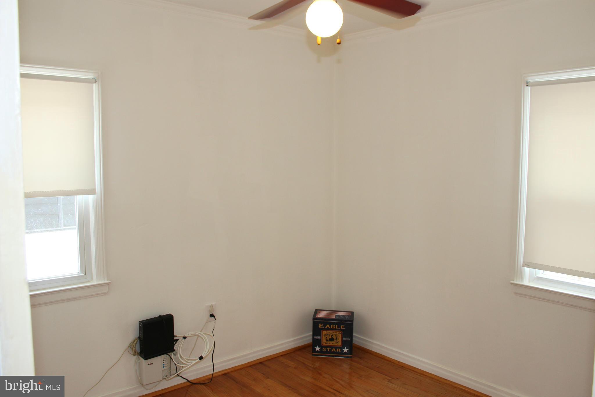 4214 Garrett Park Road Silver Spring, MD 20906 - Photo 9 of 22 an empty room with windows