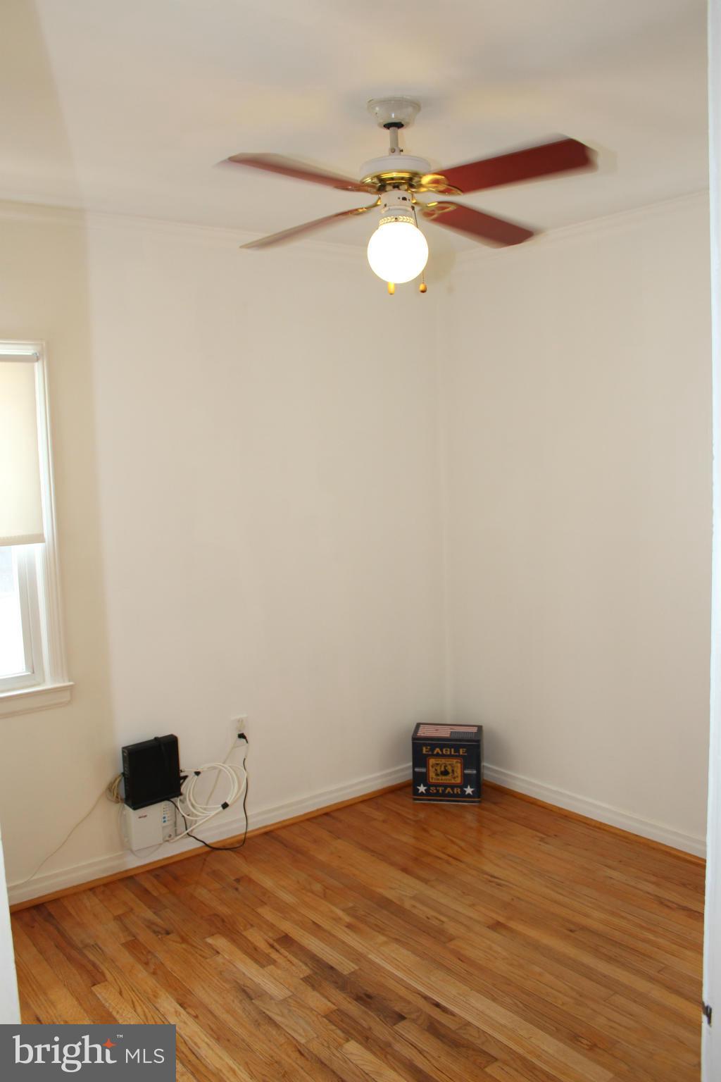 4214 Garrett Park Road Silver Spring, MD 20906 - Photo 10 of 22 a view of a room with wooden floor and fan