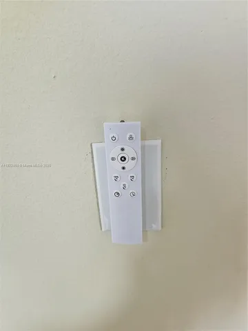 a view of a livingroom with furniture and a window