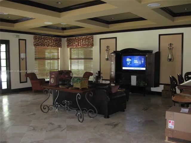 a view of a livingroom with furniture window and wooden floor