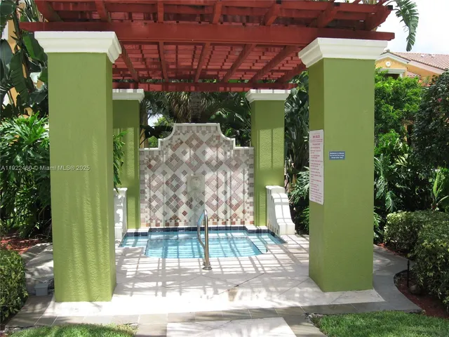 a view of a livingroom with workspace and a window